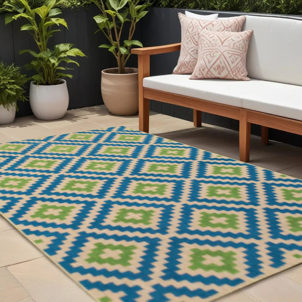 Colorful geometric outdoor rug in blue, green, and beige, perfect for patio or balcony decor, enhancing modern styling.