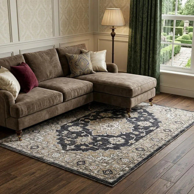 Navy and beige Persian-style area rug, detailed floral pattern, soft wool blend, complements brown sectional sofa.