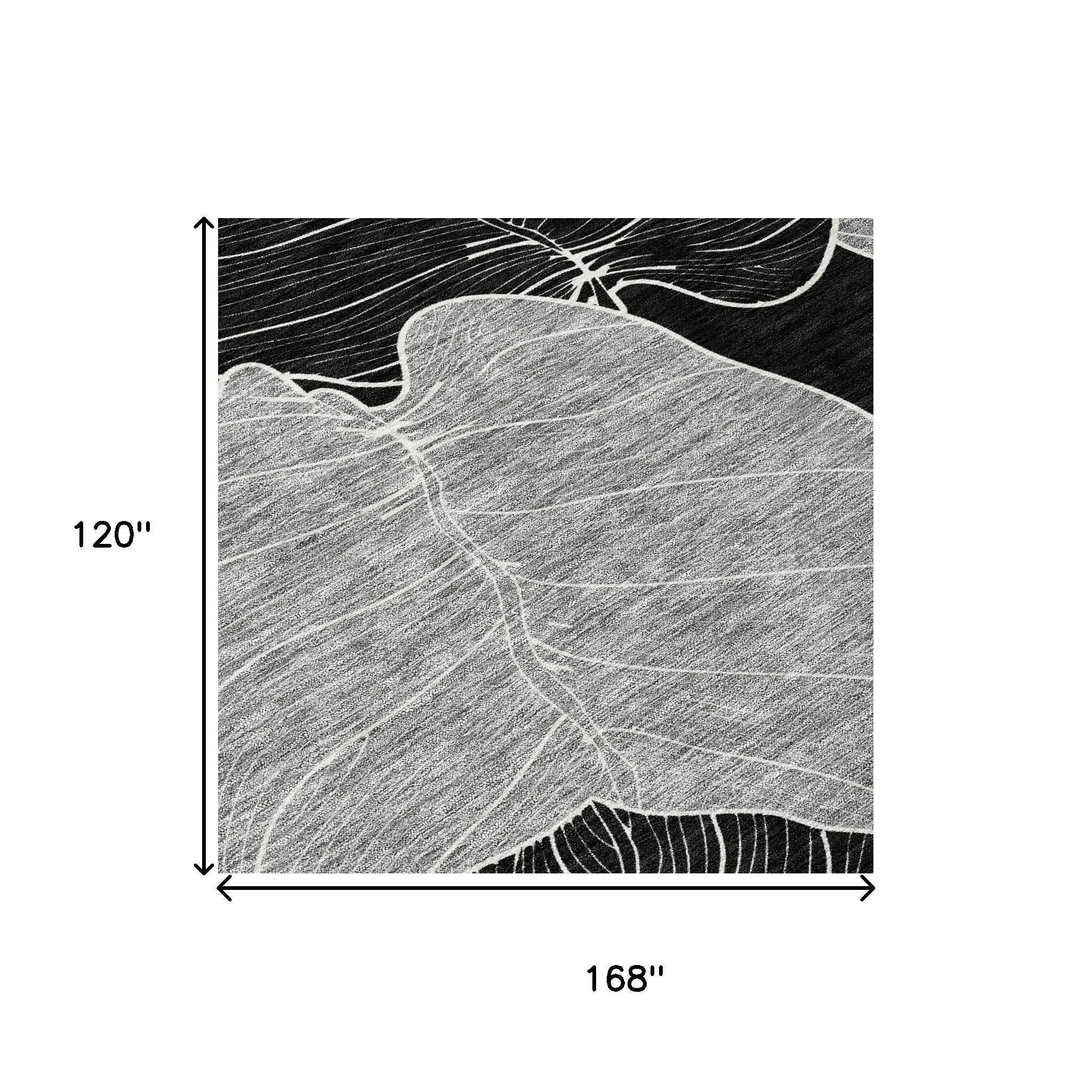 Black and white abstract leaf area rug, 120"x168", soft woven fibers, contemporary style for modern decor.