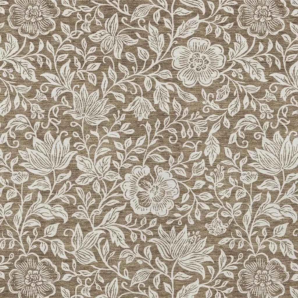 Beige floral fabric with white embroidered flowers, perfect for upholstery and home decor.