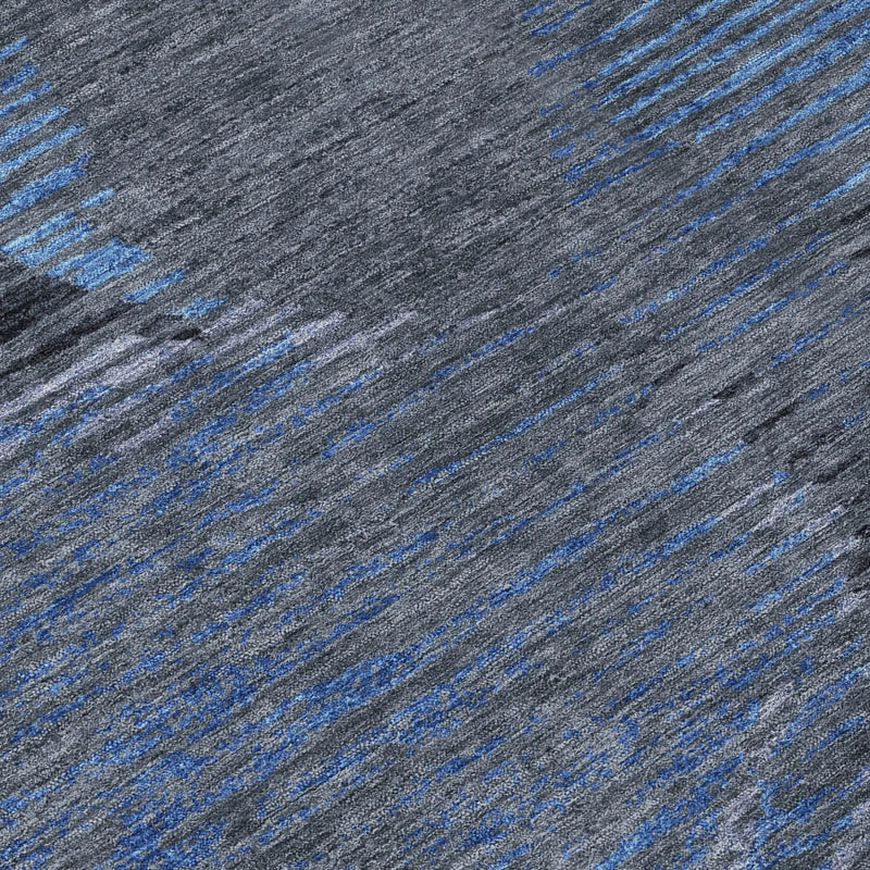 Gray and blue abstract area rug, featuring durable synthetic fibers, modern style, perfect for contemporary interiors.