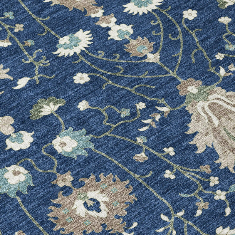 Navy blue floral area rug with beige and teal accents in a soft, durable fabric. Perfect for modern decor.