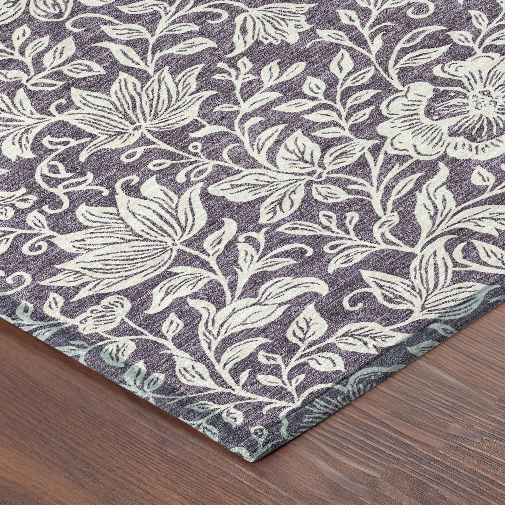 Purple floral area rug with white botanical patterns, crafted from soft, durable material for stylish home decor.