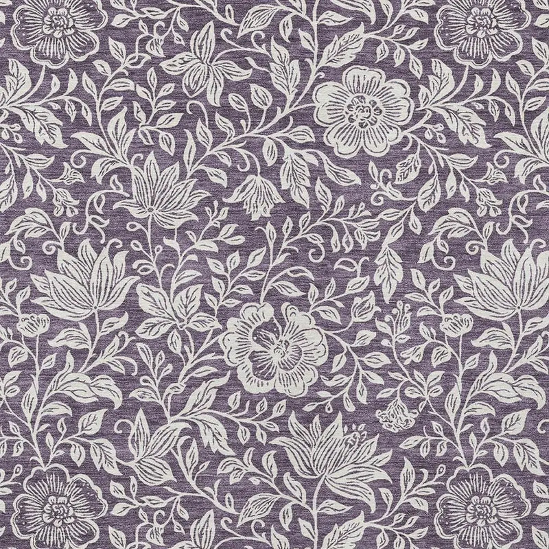 Purple floral fabric with white intricate patterns, perfect for sewing projects and home décor accents.