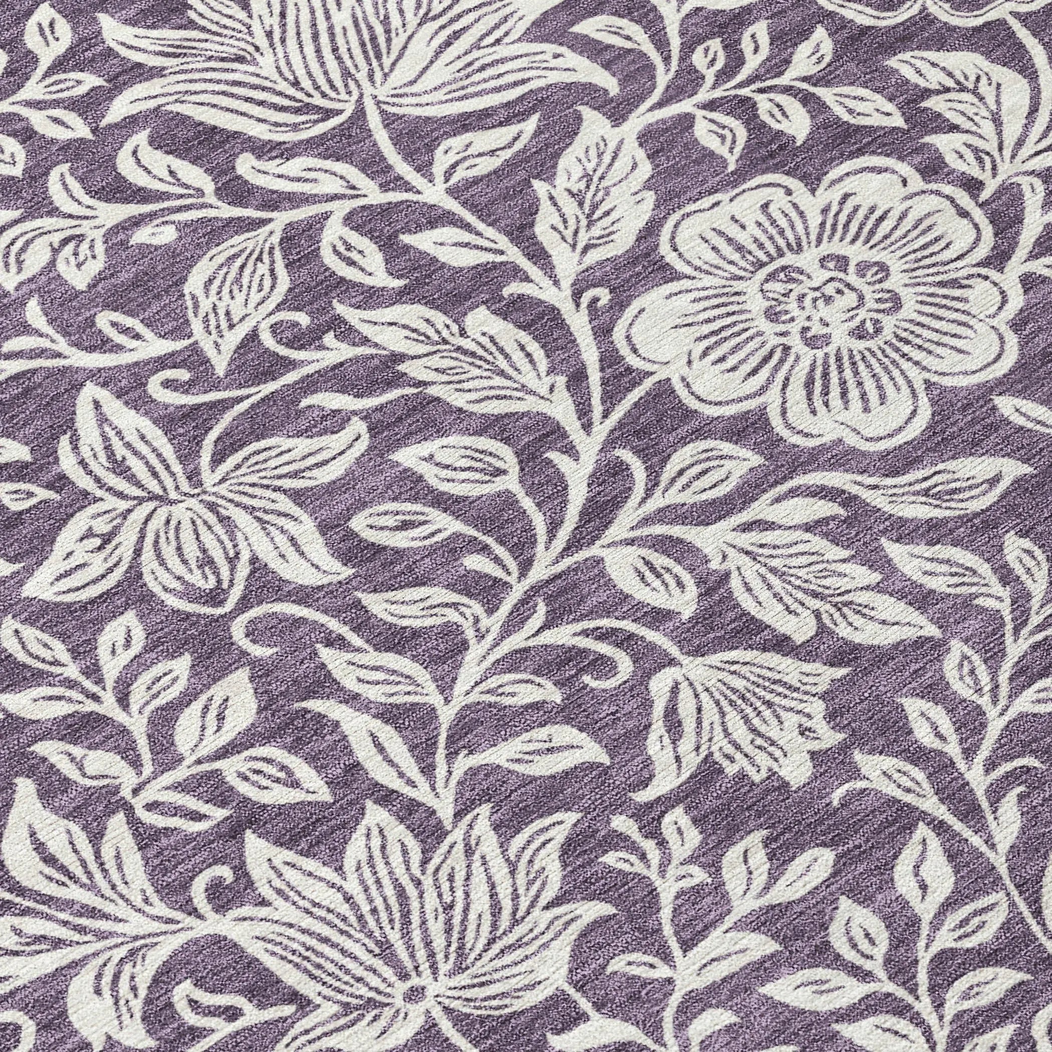 Purple floral patterned area rug with white embroidery, perfect for stylish home decor.