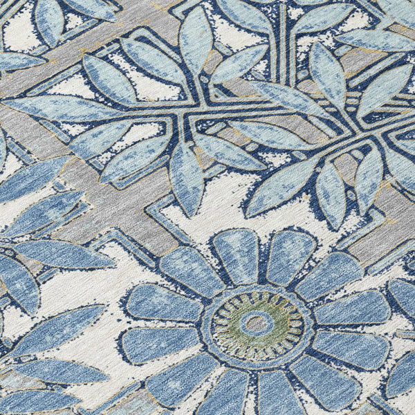 Blue floral-patterned area rug made of soft synthetic fiber, perfect for modern or coastal home decor.