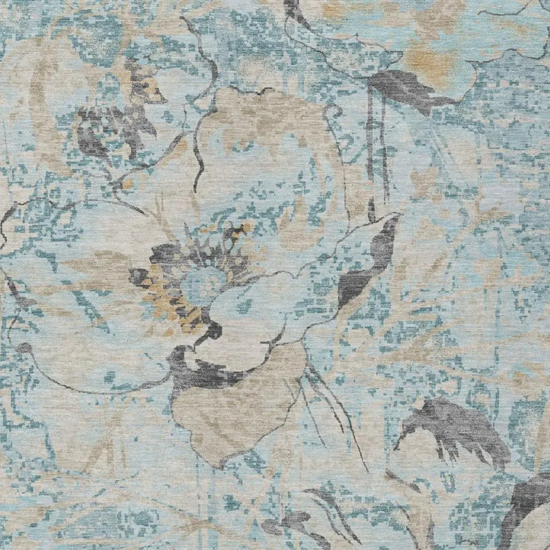 Light blue floral area rug with abstract design, featuring shades of gray and beige, perfect for modern decor.