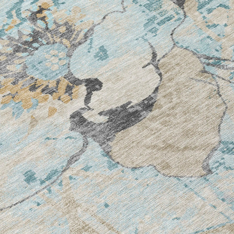 Light blue and beige floral area rug with abstract patterns, made of soft synthetic fibers, perfect for modern decor.