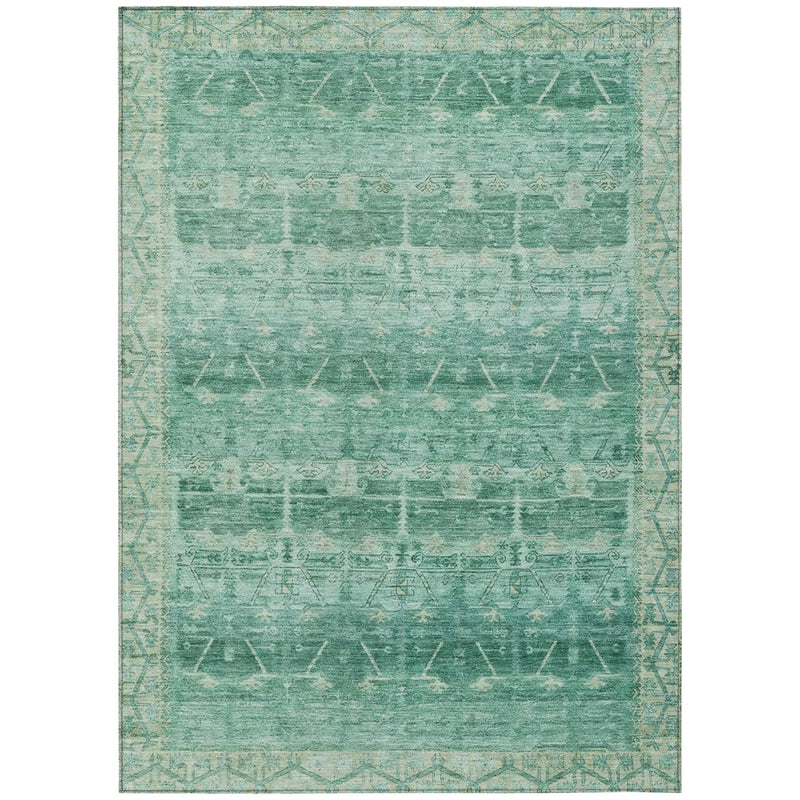 Teal vintage-style area rug with intricate geometric patterns and a soft, textured surface. Perfect for home decor.