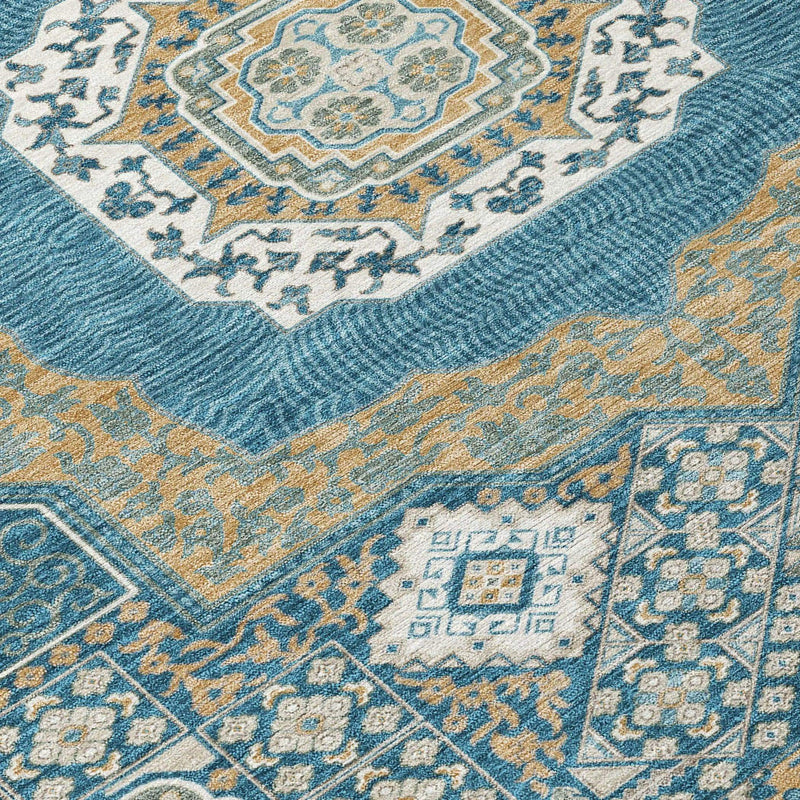 Blue and gold geometric patterned area rug, made of soft fabric, adds elegance to any room decor.