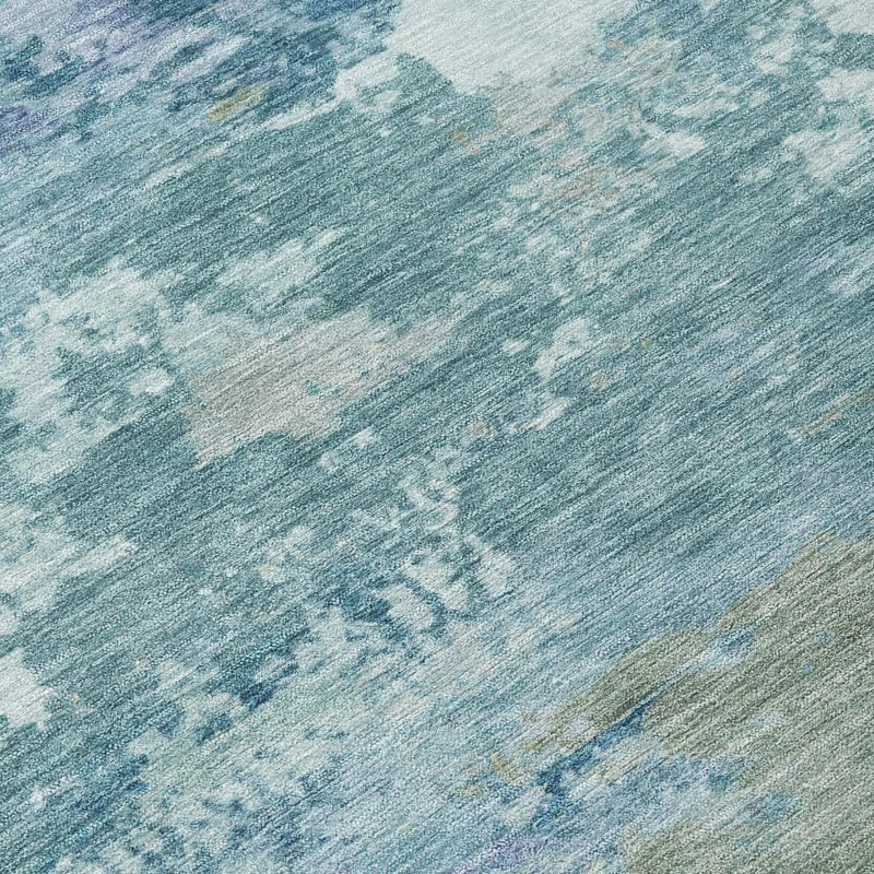 Blue and aqua abstract area rug, soft synthetic fibers, modern design, ideal for contemporary decor.