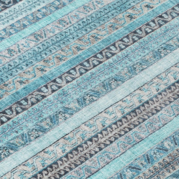 Blue and gray patterned area rug with geometric designs, crafted from soft, durable fibers for modern decor.