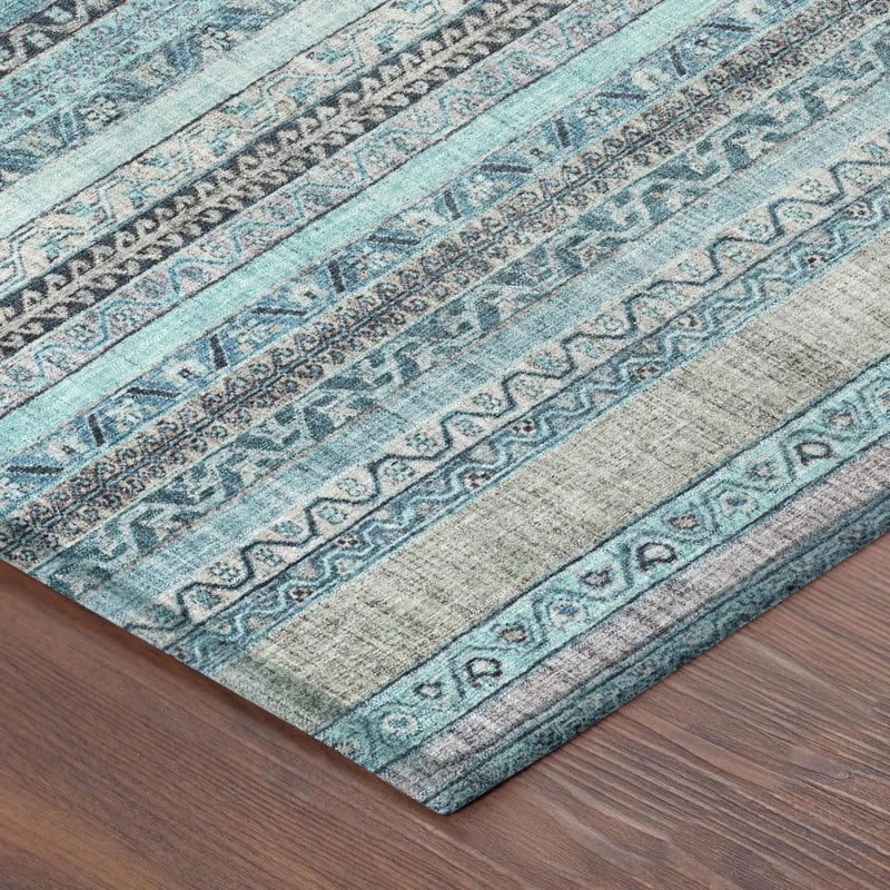 Blue and gray patterned area rug with intricate designs, made of soft, durable fibers, perfect for modern decor.