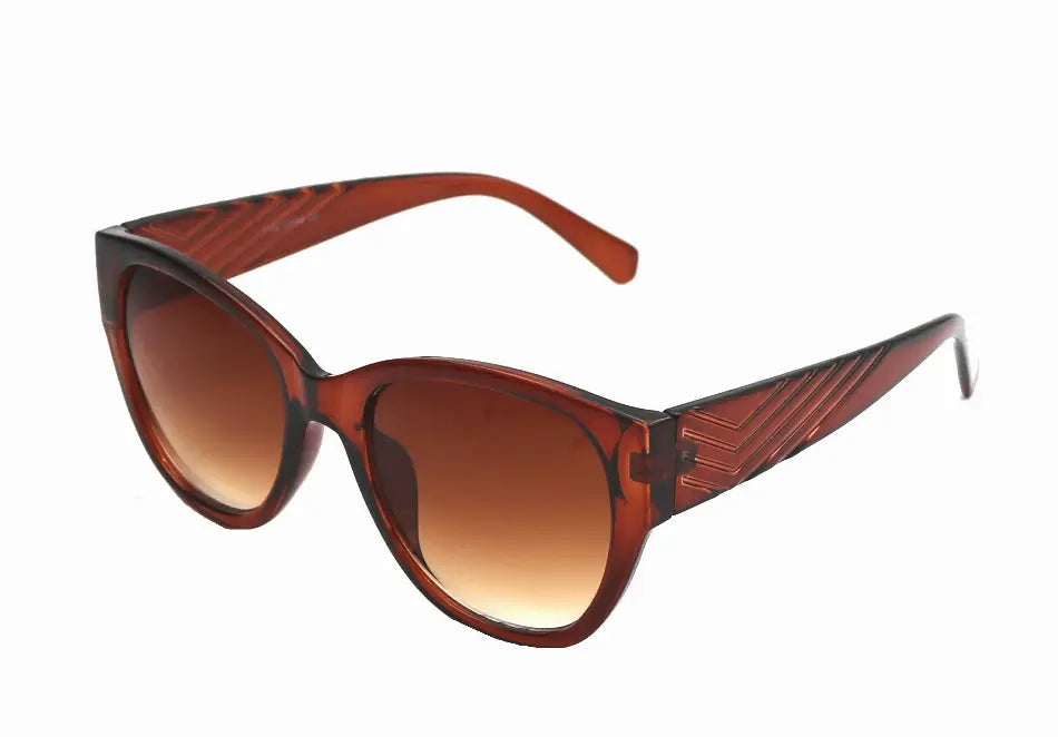 Brown gradient cat-eye sunglasses with textured arms, perfect for a chic and stylish look.