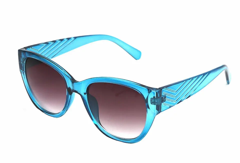 Blue retro cat-eye sunglasses with gradient lenses and stylish striped arms. Perfect for summer fashion.