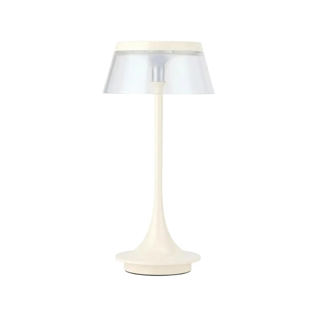 Modern cream table lamp with a clear shade, featuring a sleek, minimalistic design and a stylish silhouette.
