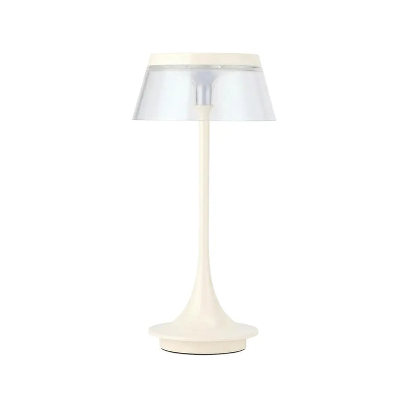 Modern cream table lamp with a clear shade, featuring a sleek, minimalistic design and a stylish silhouette.