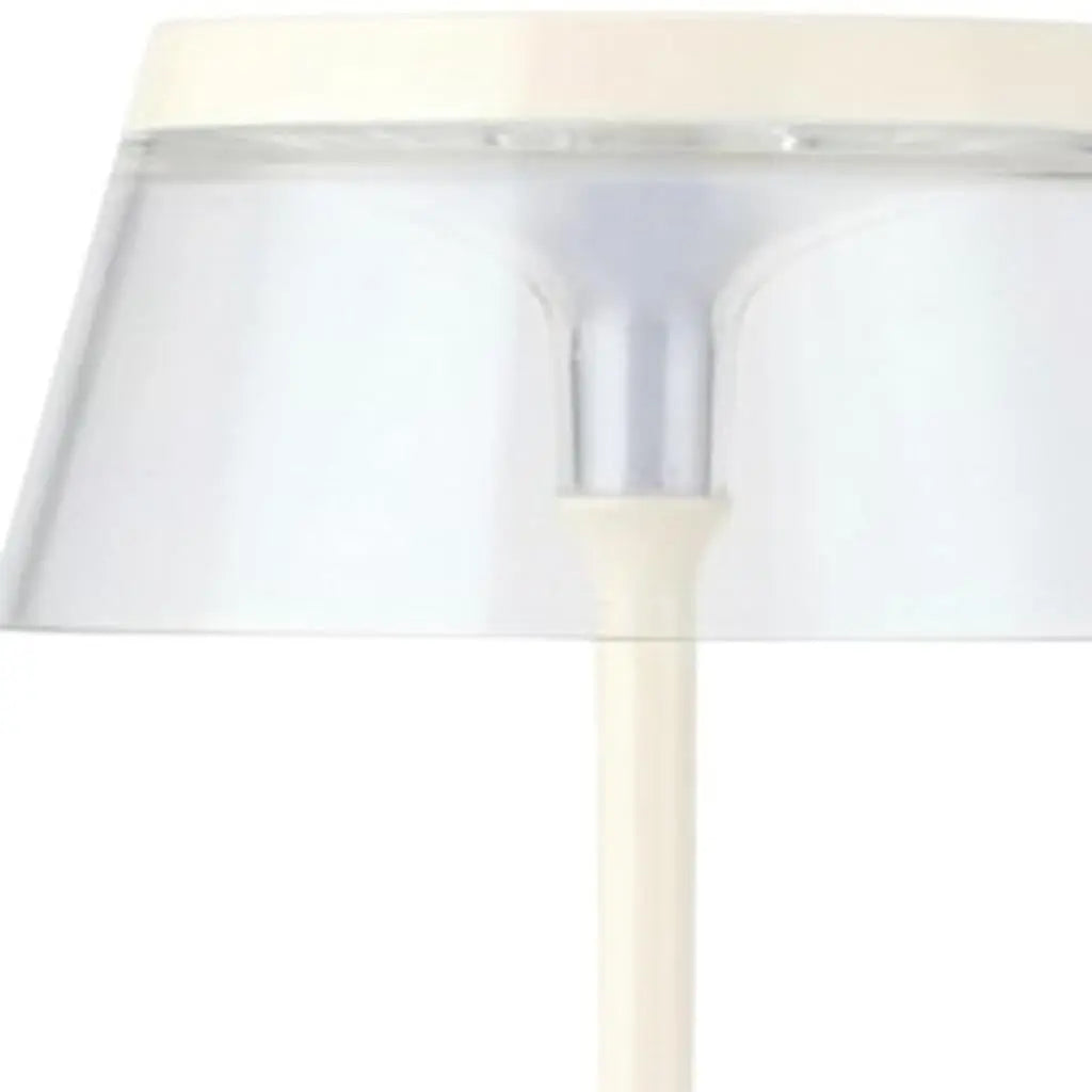 White modern table lamp with a transparent shade and sleek design, perfect for minimalistic decor.
