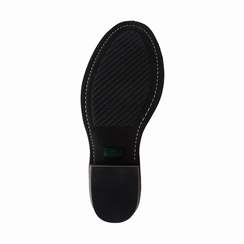 Bottom view of 9-inch packer boot sole, textured tread with brand label