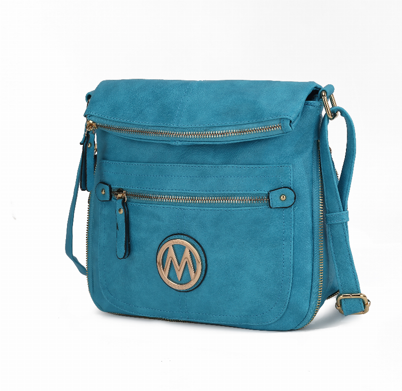 Teal suede crossbody bag with flap, front zip pocket, gold-tone logo and strap