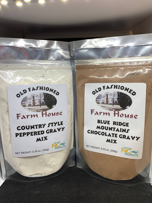 Two gravy mix pouches: peppered country style and Blue Ridge mountains chocolate mix