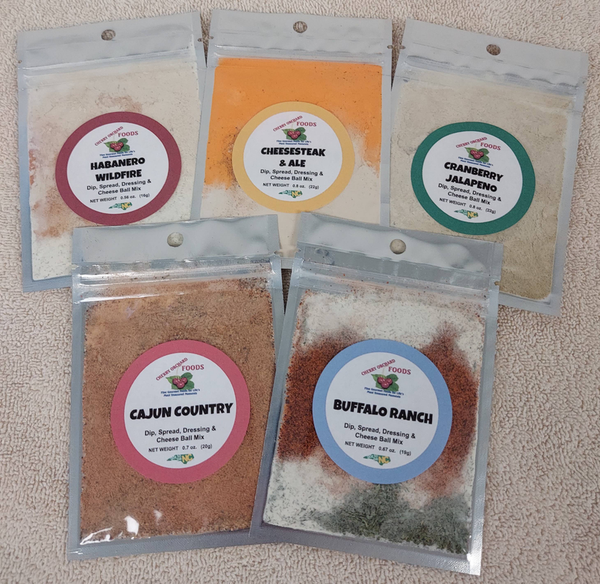 Assorted dip mix packets labeled Habanero Wildfire, Cheesesteak & BBQ, Cranberry Jalapeno