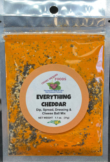 Everything Cheddar dip mix packet with orange seasoning blend and circular label