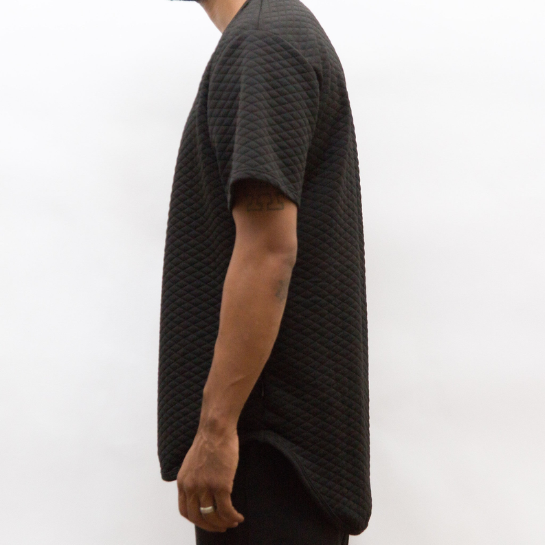 Quilted scallop tee, dark charcoal quilted texture, relaxed short-sleeve side view