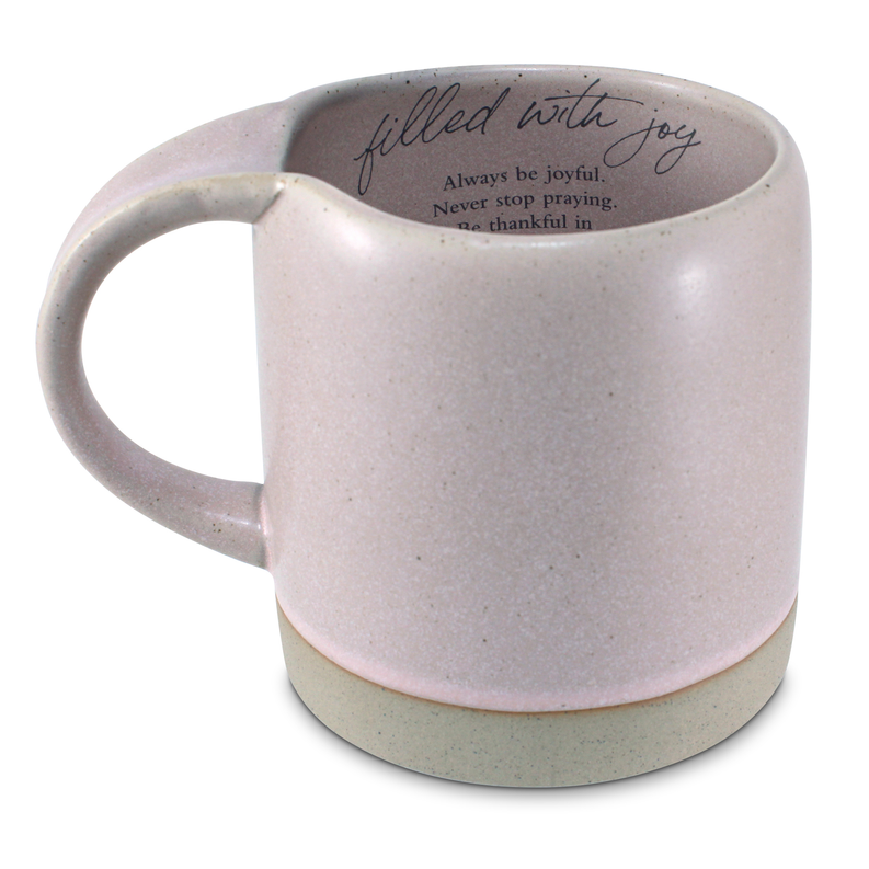 Speckled pink ceramic mug with script “filled with joy” and quote on inner rim