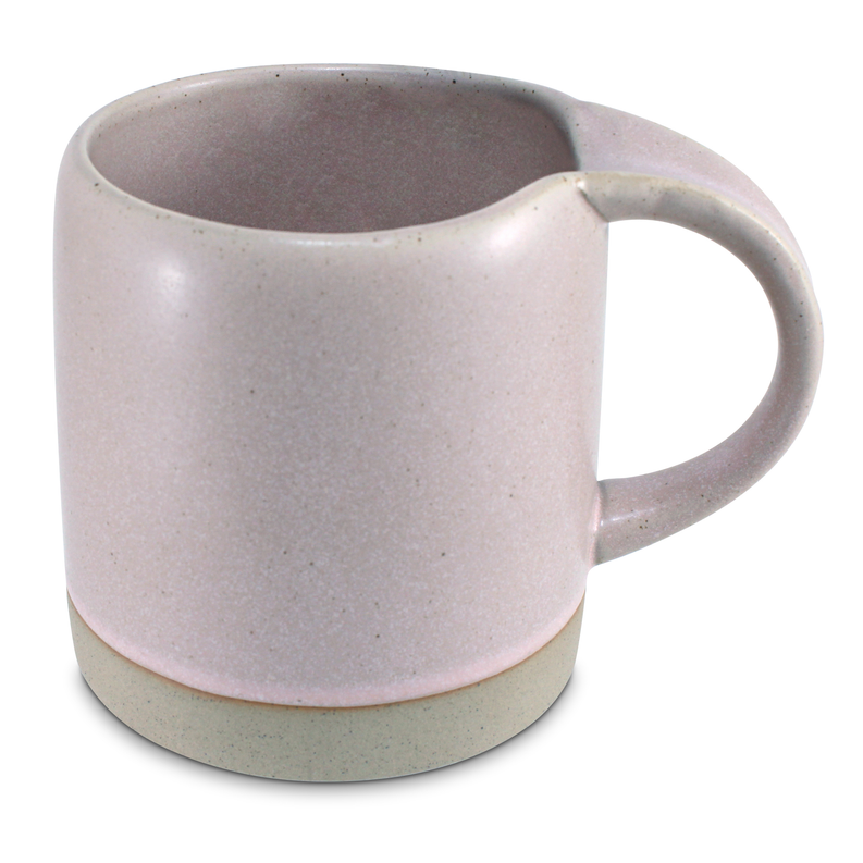 Speckled light pink ceramic mug with large handle and open rim, no visible text