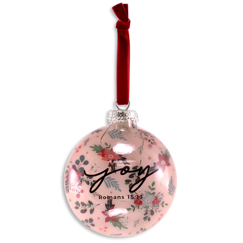 Pink round Christmas ornament with “Joy” script, floral graphics, and Romans 15:13