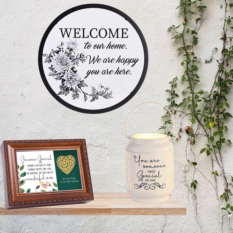 Round framed welcome wall art with black border and floral text 'WELCOME to our home'