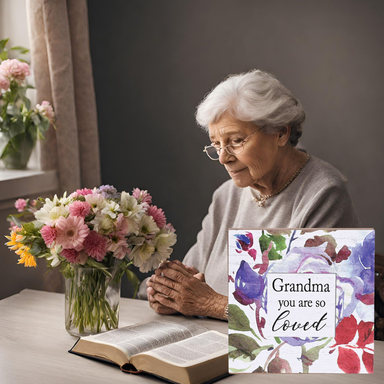 Keepsake box with floral lid on table, 'Grandma you are so loved' on top.
