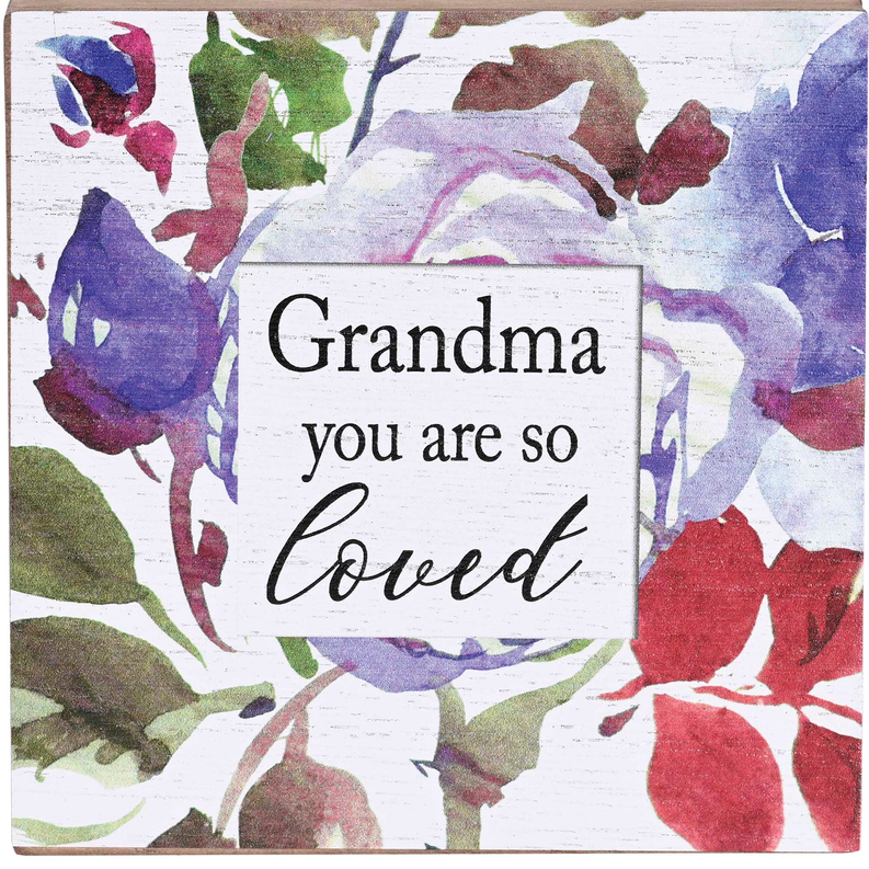 Close-up of floral keepsake box lid with 'Grandma you are so loved' text.
