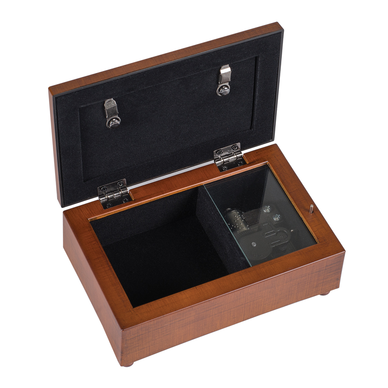 Open wooden music box with black velvet interior and hinge hardware, music cylinder view