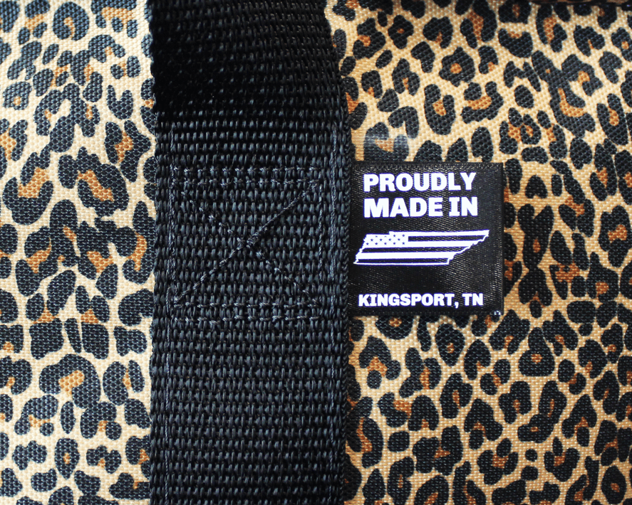 Proudly made in Kingsport, TN label on leopard-print tote strap