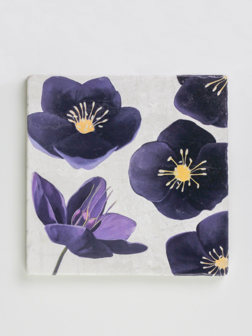 Square floral trivet, top view, white base with dark blue flower pattern