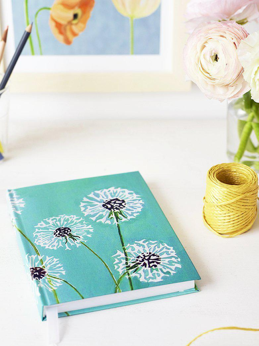 Turquoise journal with white dandelion floral print cover