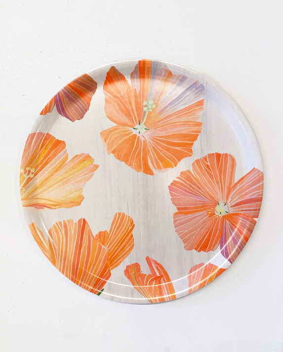 Round Swedish serving tray with orange hibiscus blossoms pattern on white