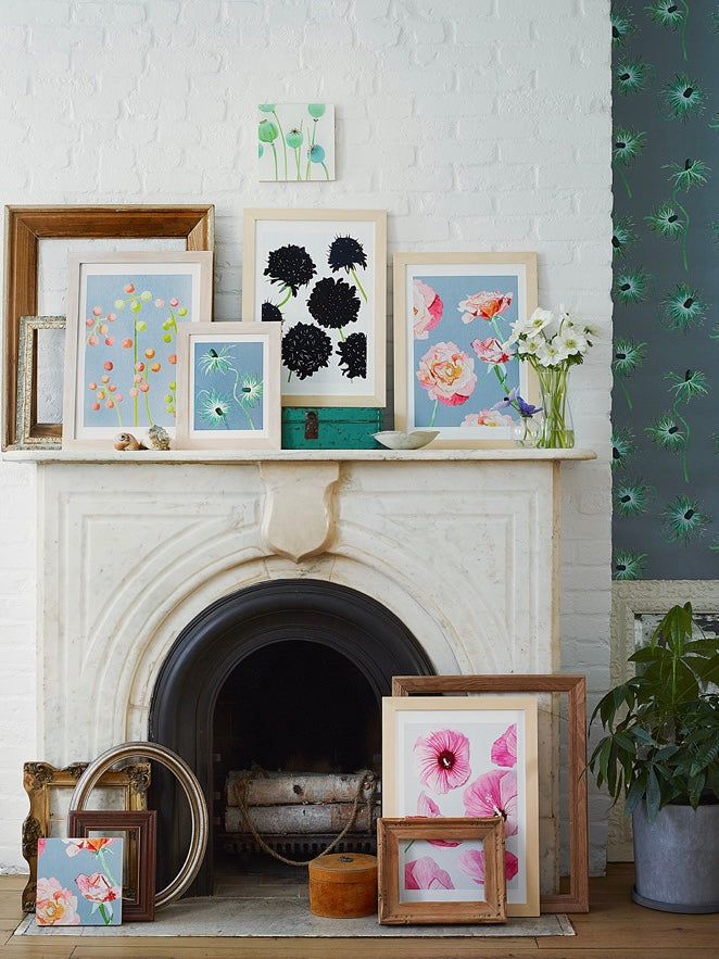 Framed black scabiosa art print with dark blooms on light paper, in a white frame