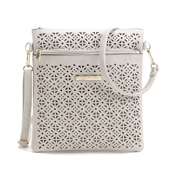 White cutout flower crossbody handbag with front zipper and curved strap pocket