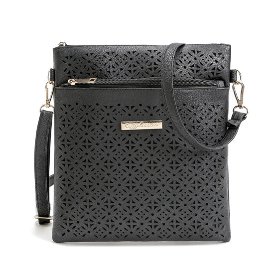 Black perforated cutout flower crossbody handbag with front panel and shoulder strap