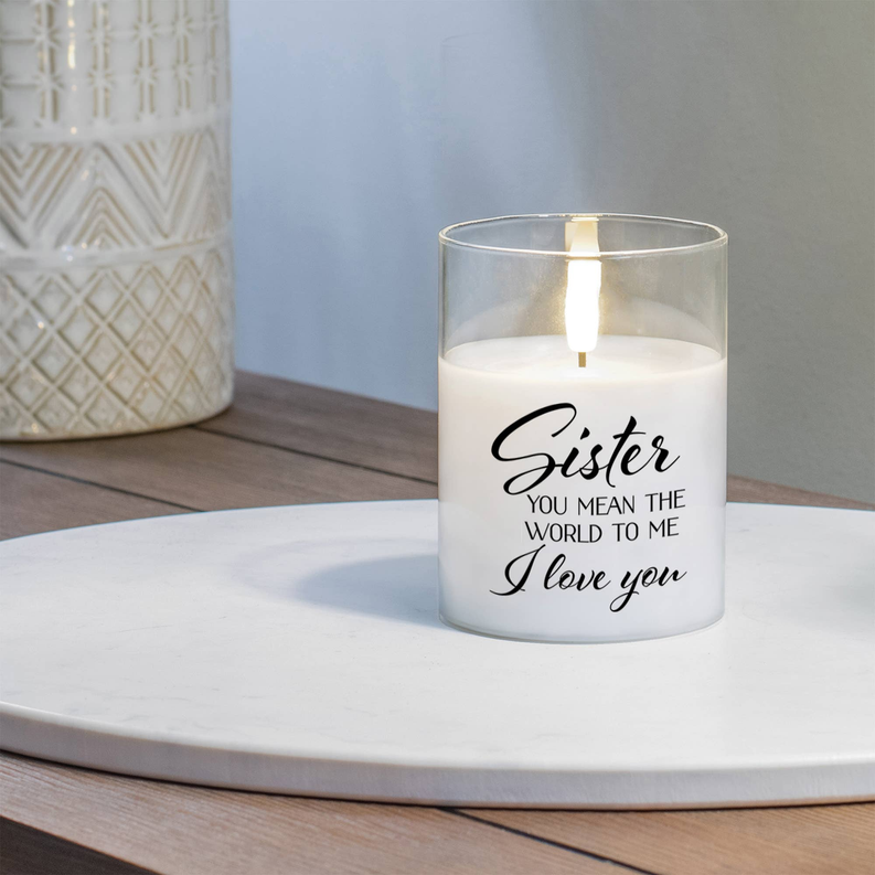 LED candle in clear glass jar with 'Sister' message, lit on tray