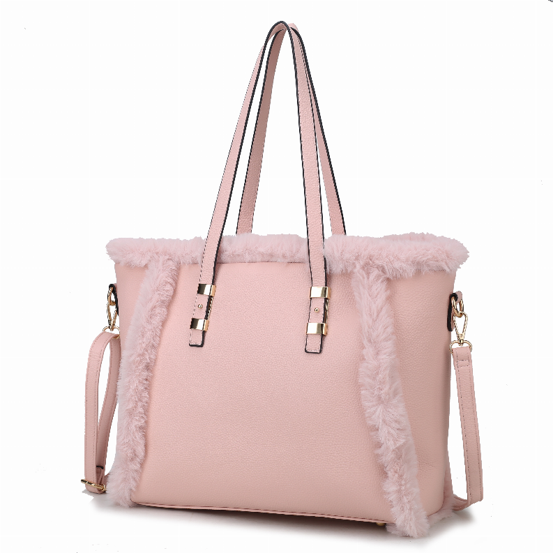 Women's pink tote bag with faux fur side panels, gold-tone buckles, and handles