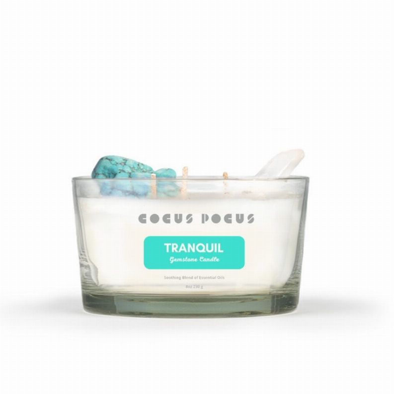 Crystal candle in clear glass jar with teal wax and white label