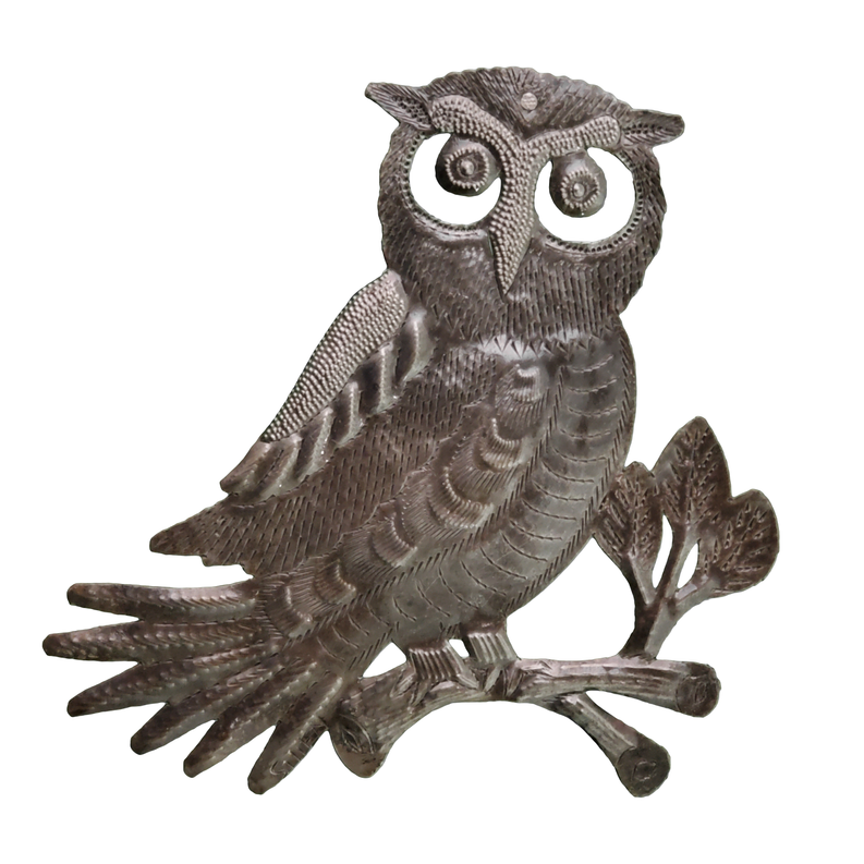 Recycled steel owl sculpture perched on branch, detailed feathers and large eyes