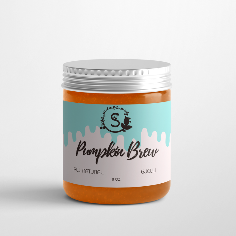 Pumpkin Brew candle jar with silver lid, orange-and-teal label, 8 oz.
