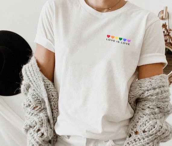 White crewneck T-shirt with chest “LOVE IS LOVE” text and rainbow heart graphic
