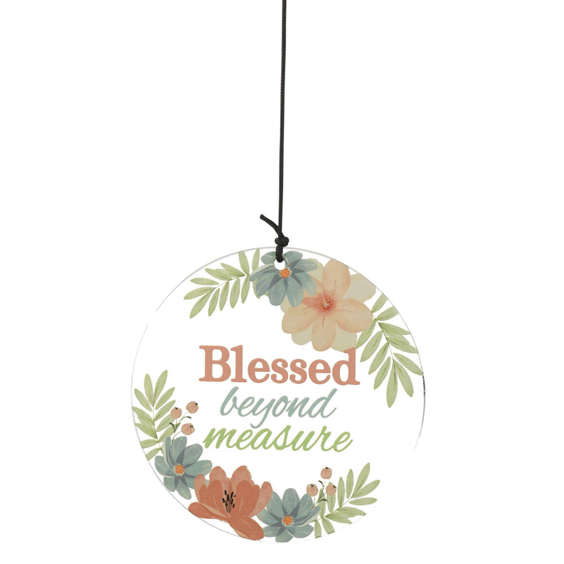 Floral wind chime disk reading 'Blessed beyond measure' with hanging cord