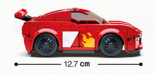 Red brick sports car side view, black wheels, flame stripe on door